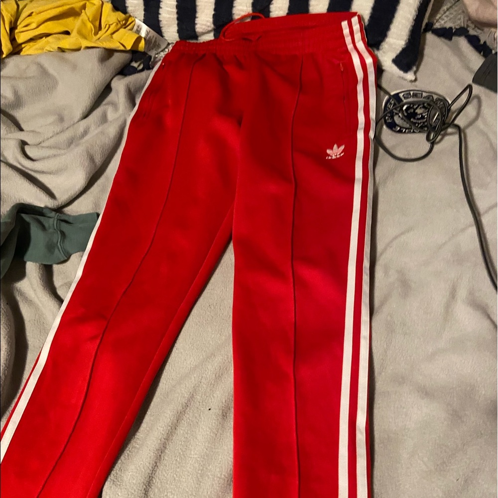 red adidas track pants